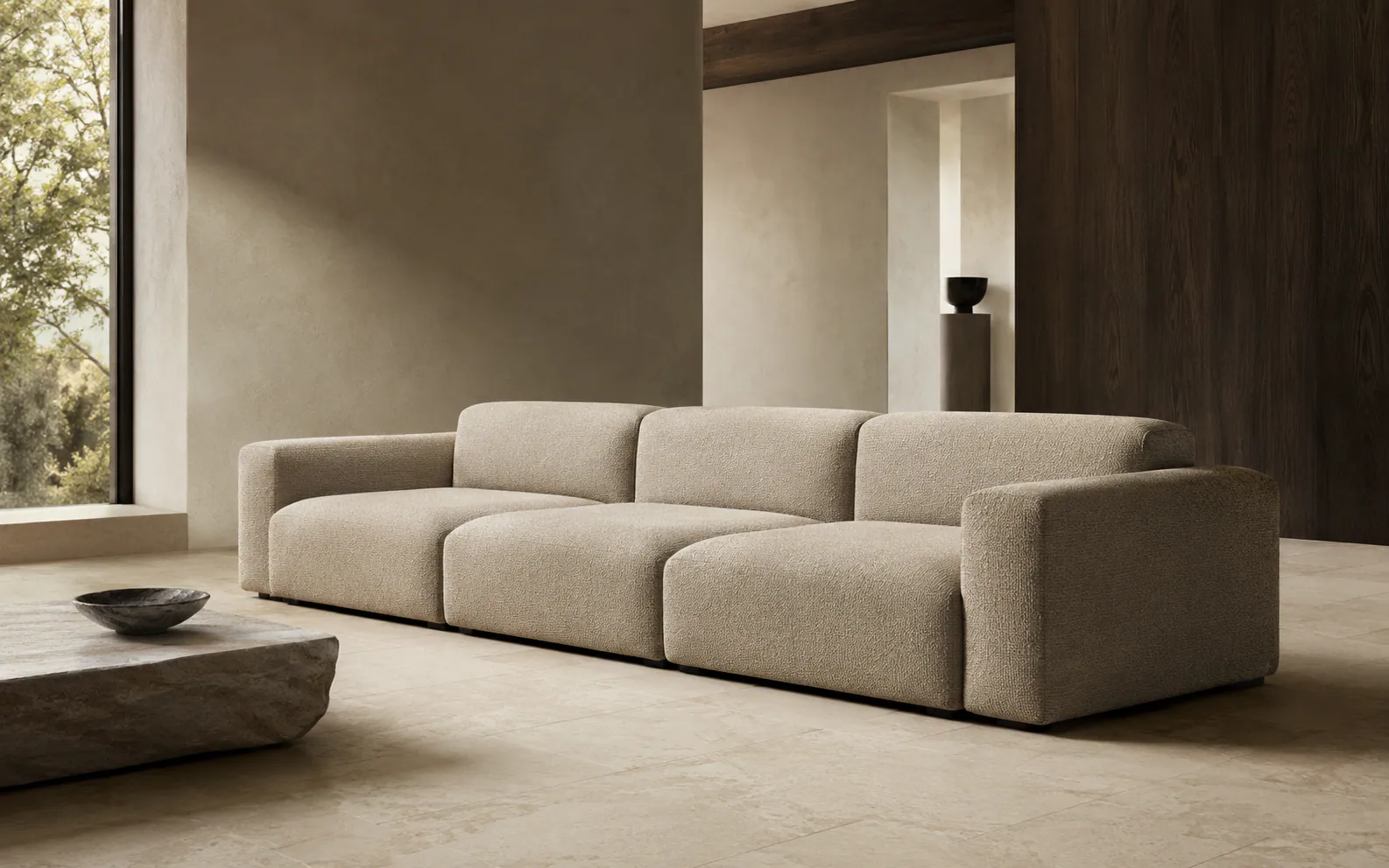 Modular sofa visualized in a quiet architectural interior