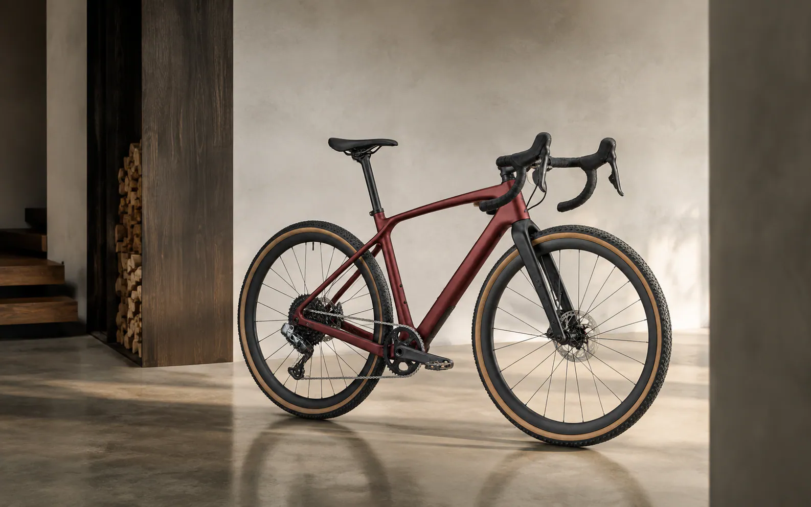 Configured gravel bicycle shown in a warm architectural setting